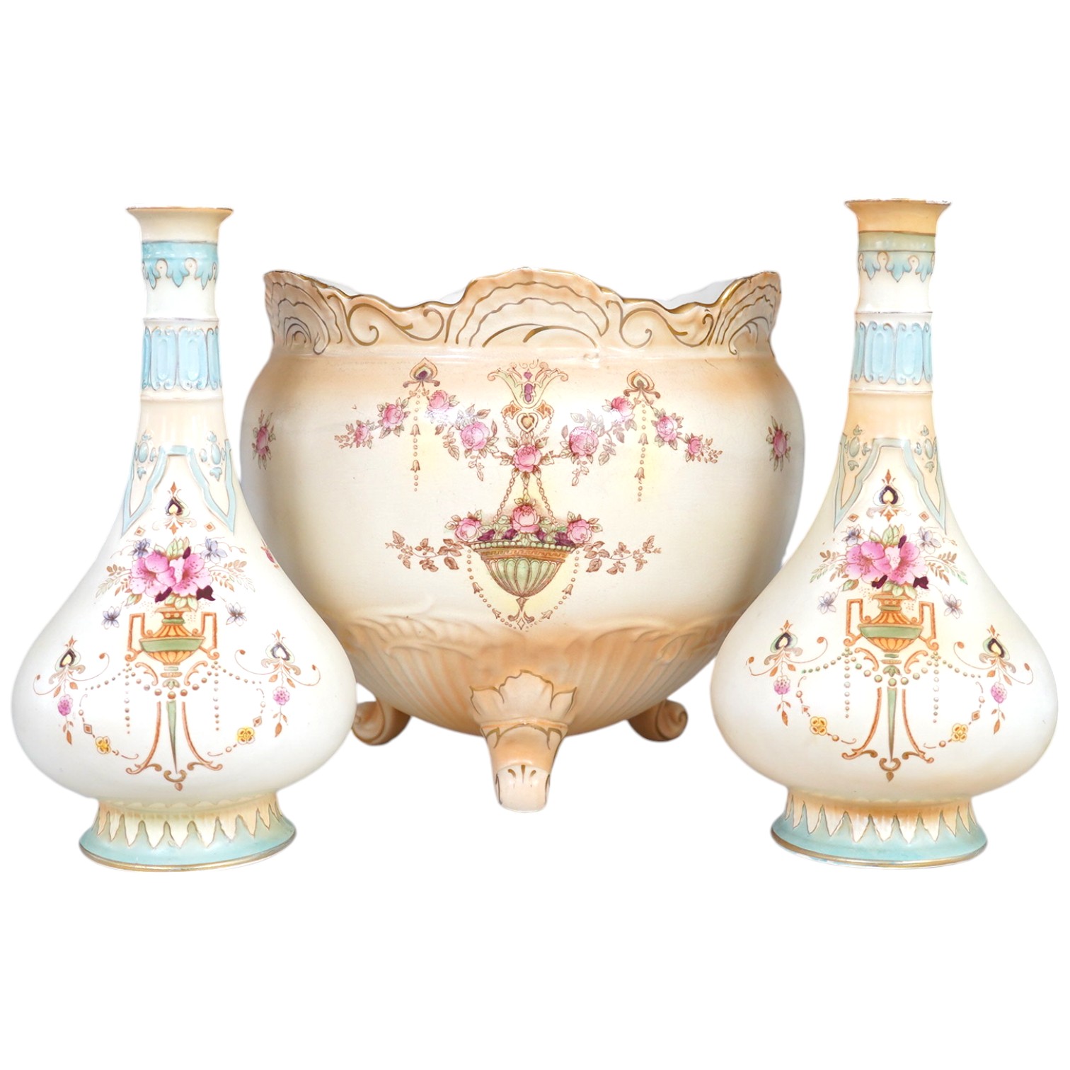 A Crown Devon jardiniere, 23cm high, and a pair of vases, 25.5cm high. Condition - fair to good